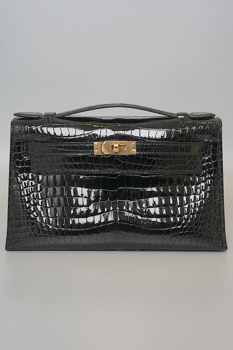 Hermes Kelly Pochette in Black Shiny Porosus Ghw