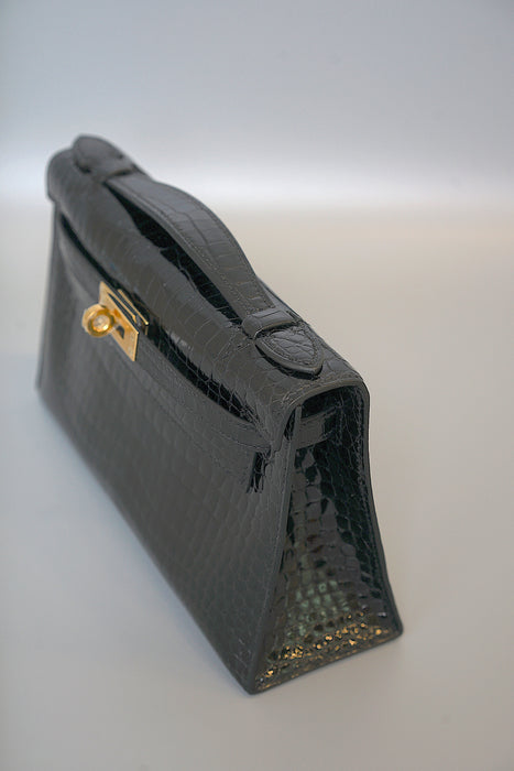 Hermes Kelly Pochette in Black Shiny Porosus Ghw