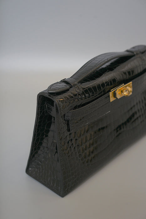 Hermes Kelly Pochette in Black Shiny Porosus Ghw